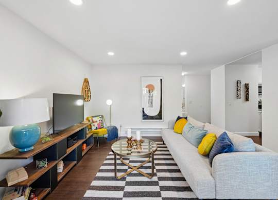 Living room at Grove Apartments with contemporary furnishings and open floor plan.