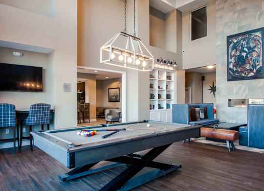 our apartments showcase a clubhouse with a pool table