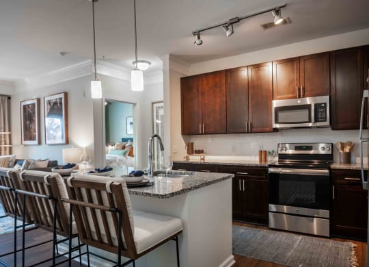 a kitchen and living room in a 555 waverly unit