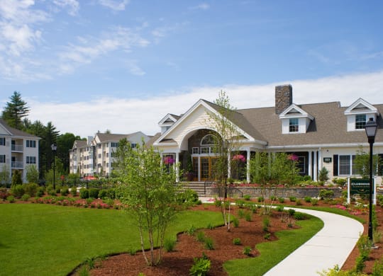 a large house with a garden in front of it