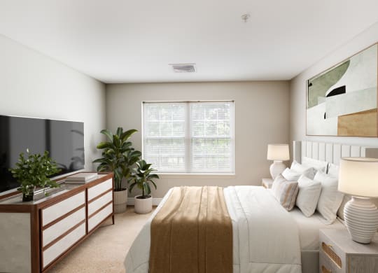 a bedroom with a large bed and a tv