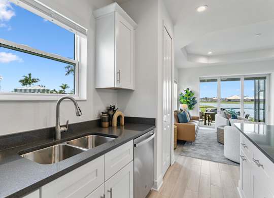 A modern kitchen with a view of the ocean at Marisol in Lakewood Ranch, FL