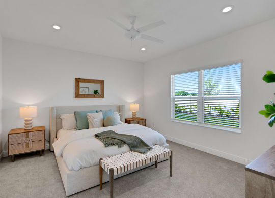a bedroom with a bed and a ceiling fan at Marisol, Bradenton Florida 34211