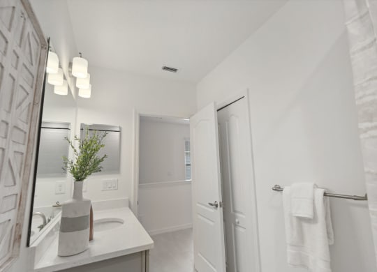 Upstairs bathroom sink vanity in three bedroom home at Martinique