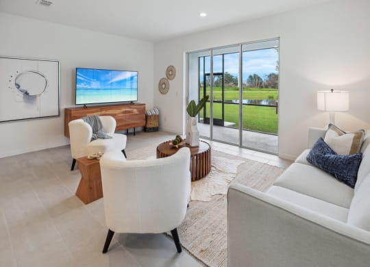 Living room with patio view from 3 bedroom townhome at Martinique