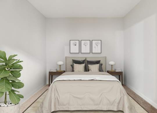 A bedroom with a bed, two lamps, and two pictures on the wall.