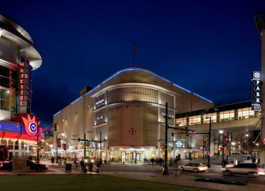 View of Citron at night with cars in front.