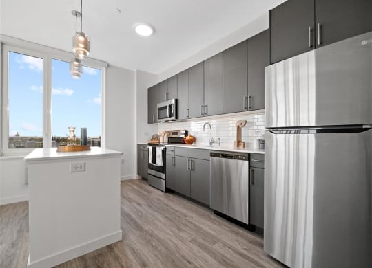 Modern kitchens with sleek stainless steel appliances at The Brick of Hackensack, Hackensack