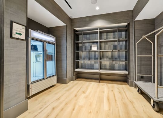 a room with wood flooring and a bookshelf filled with books