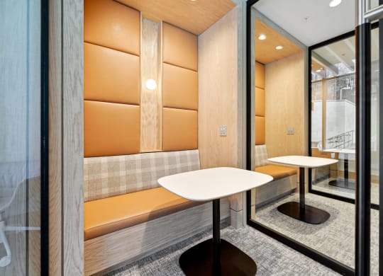 the lobby of the building has a wall of curving wood panels
