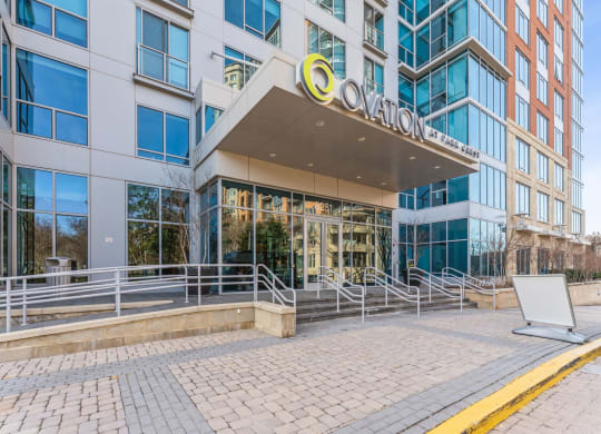 an office building with a large ovation sign on the front of it