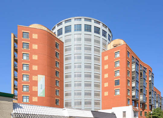 a city building with a blue sky in the background