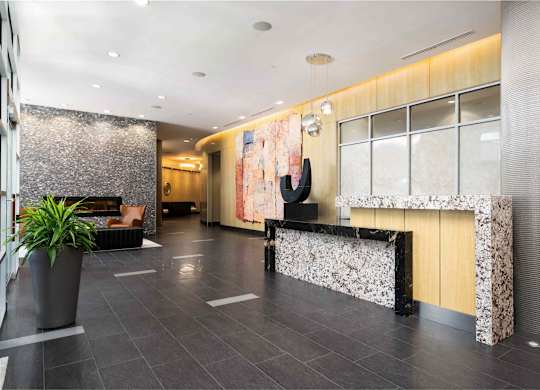 the lobby of a hotel with a reception desk