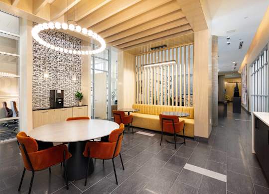 a dining room with a table and chairs