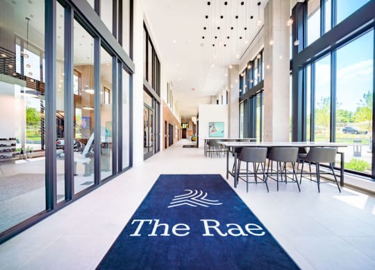 a blue rug with the name of the race on the floor of a building
