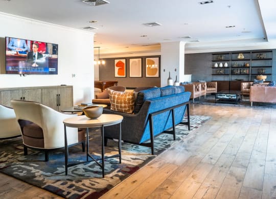 a living room filled with furniture and a tv