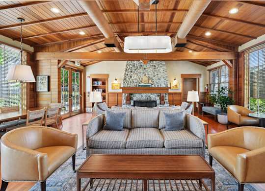 Interior clubhouse seating area with warm wood design and open layout