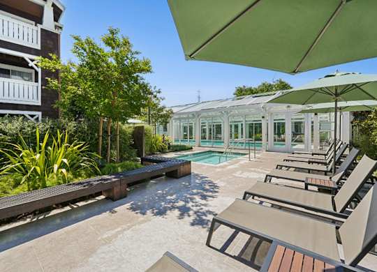 pool deck with outdoor seating and courtyard views