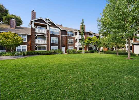 landscaped apartment grounds with greenery and pathways
