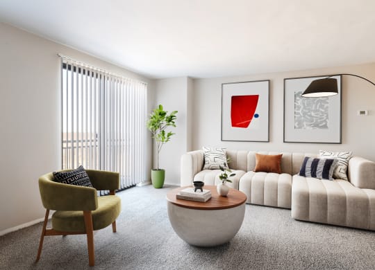 a living room with a white couch and a coffee table