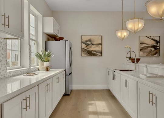 Community kitchen with white finishes and spacious counters at Brandywine Crossing, Brandywine, MD 20613