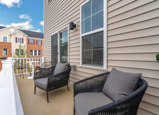 Townhome balcony with seating at The Retreat at Brandywine Crossing, Brandywine, MD 20613