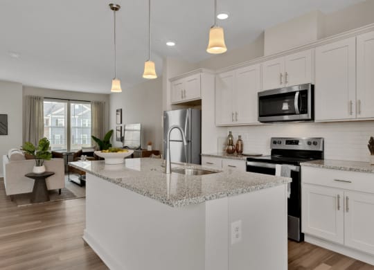 Kitchen with large island looking into living room at Brandywine Crossing, Brandywine, MD 20613