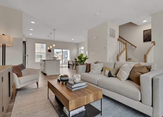 Living room with view of kitchen and stairs at Brandywine Crossing, Brandywine, MD 20613