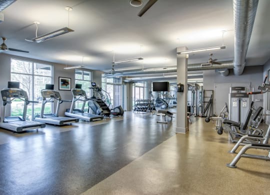 a gym with cardio machines and other exercise equipment