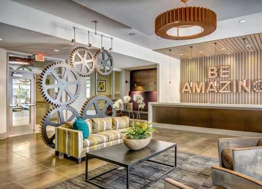 a lobby with couches and a coffee table