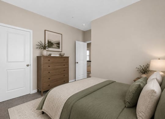 Bedroom with neutral walls, closet door, and soft lighting.