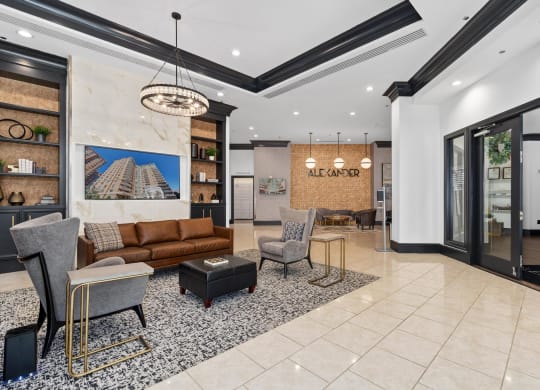 a living room with a couch and chairs in a lobby