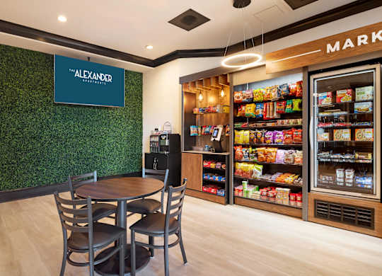 A market with a green wall and a sign that says Alexander.