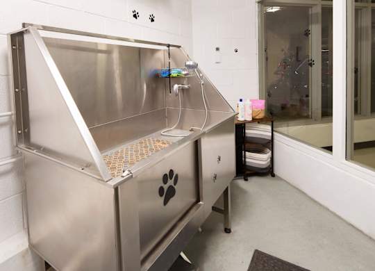 A large stainless steel machine with a paw print on it.