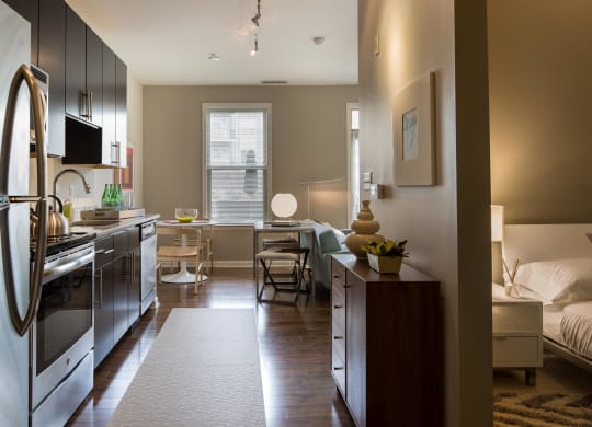 a small apartment with a kitchen and a living room