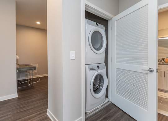A white washer and dryer in a laundry room.