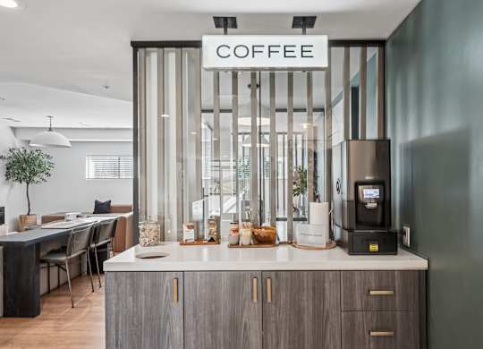 A modern coffee bar with a sign that reads at The Magwood in Boulder, Colorado.