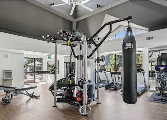 A gym with a variety of equipment including a punching bag at The Magwood in Boulder, Colorado.