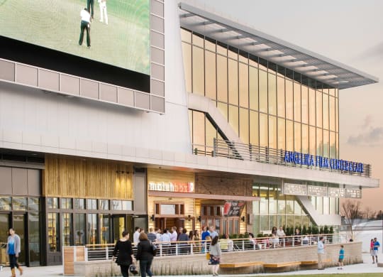 a rendering of the exterior of a building with a large tv screen on the side