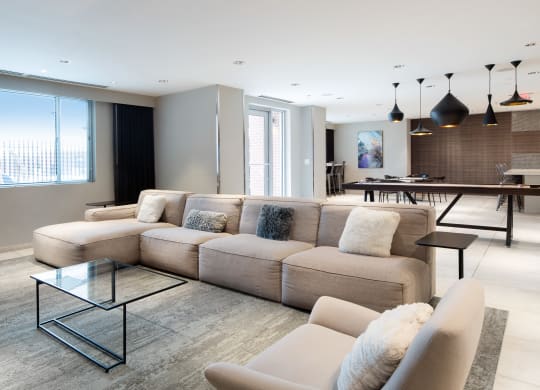 a large living room with a large couch and a table
