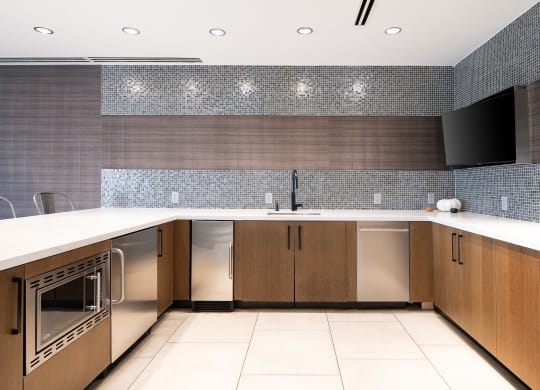 a large kitchen with a counter top and a sink