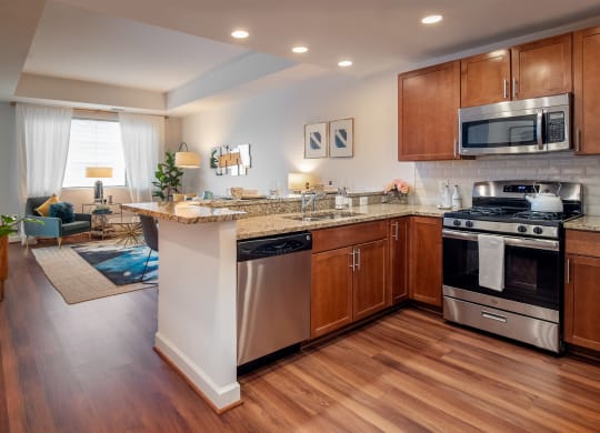 a kitchen with an island and a stove and a microwave