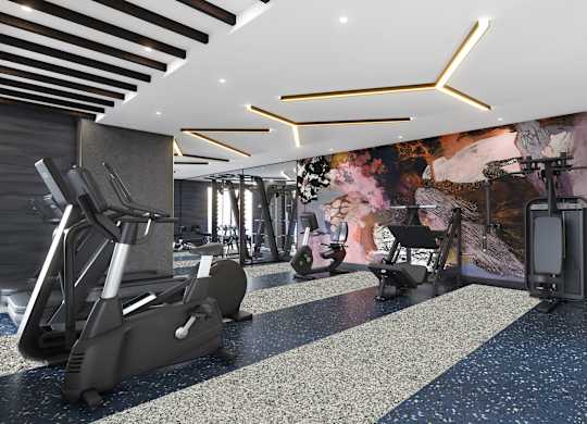 A gym with treadmills, elliptical machines, and other exercise equipment.
