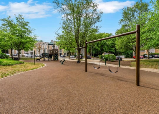 Woodbridge Station community playground with swings