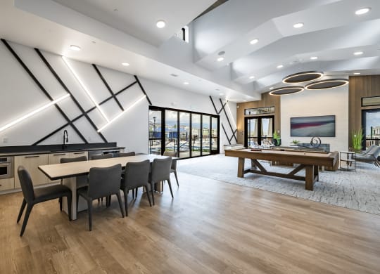 clubroom with a table and chairs and a billiards table