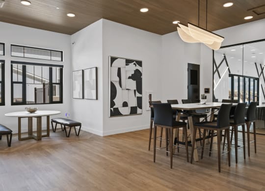 a table and chairs and a large window