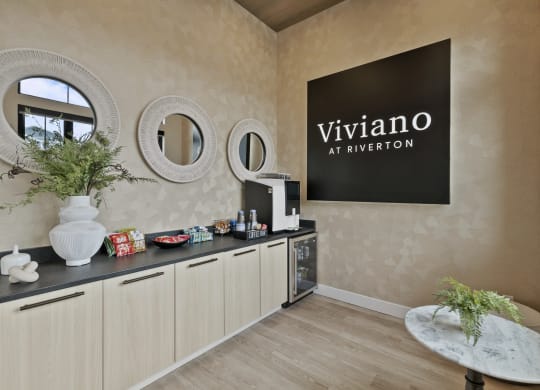 coffee area with a viviano sign on the wall and a counter top