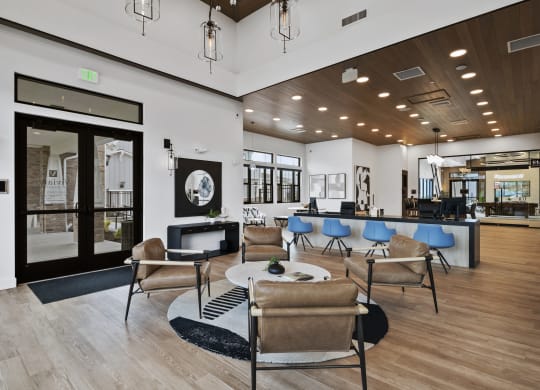 a lobby with chairs and tables