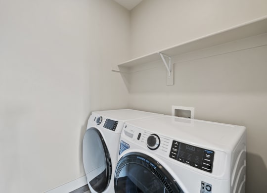 laundry room with built in shelving