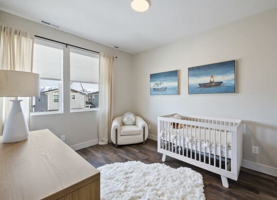 Furnished bedroom with crib
